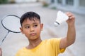 Asian kid boy playing badminton at home Royalty Free Stock Photo