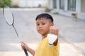 Asian kid boy playing badminton at home Royalty Free Stock Photo