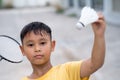 Asian kid boy playing badminton at home Royalty Free Stock Photo