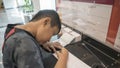 Asian kid filling up immigration form