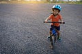 Asian kid first day play balance bike. Royalty Free Stock Photo