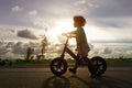 Asian kid first day play balance bike. Royalty Free Stock Photo