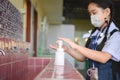 Asian kid girl student washing hands and wearing masks at school. Reopen school from lockdown. Covid-19 coronavirus pandemic. New