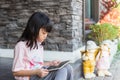 Asian kid girl using tablet for online learning. Royalty Free Stock Photo