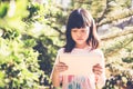 Asian kid girl using tablet play game. Royalty Free Stock Photo