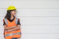 Asian Kid girl wearing reflective shirts and a hat yellow. To learning and enhance development, little architect Royalty Free Stock Photo