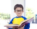 Asian kid holding book