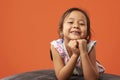 Asian kid posing on a beanbag Royalty Free Stock Photo