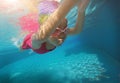 Happy asian kid swimming underwater in summer. Royalty Free Stock Photo