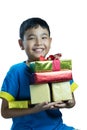 Asian kid smile holding stack of presents boxes Royalty Free Stock Photo