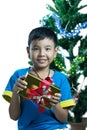 Asian kid smile receive Christmas gift Royalty Free Stock Photo