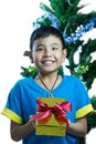 Asian kid smile receive Christmas gift Royalty Free Stock Photo