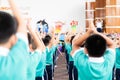 Asian kid stand in the line and exercise at outdoor