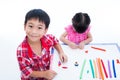 Asian kids playing with play clay on table. Strengthen the imagination Royalty Free Stock Photo