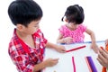 Asian kids playing with play clay on table. Strengthen the imagi