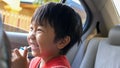Asian kindergarten child boy drinking yogurt milk from straw Royalty Free Stock Photo
