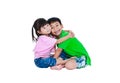 Asian kindly brother hugging his sister smiling happy together, Royalty Free Stock Photo