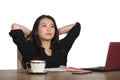 Asian Korean businesswoman working in stress at office computer desk feeling overwhelmed and frustrated suffering depression think Royalty Free Stock Photo