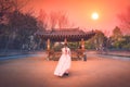 Asian korean Girls dressed Hanbok in traditional dress at sunset in South Korea