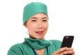 Asian Korean woman as successful physician using hand phone - young beautiful and happy medicine doctor or chief hospital nurse Royalty Free Stock Photo