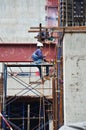 Asian labor people and thai labour worker use machine and heavy machinery working builder railway track electric sky train at