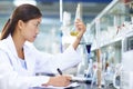 Asian Laboratory scientist working at lab with test tubes Royalty Free Stock Photo