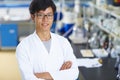 Asian Laboratory scientist working at lab with test tubes Royalty Free Stock Photo