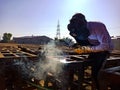 an asian labour welding on iron structure during indian railway bridge construction in india January 2020 Royalty Free Stock Photo