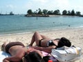 Asian ladies bikini suntanning Royalty Free Stock Photo