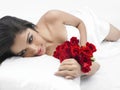 Asian lady in bed with roses