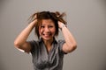 Asian lady in business attire, very frustrated Royalty Free Stock Photo