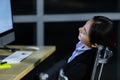 Asian lady call center worker employee sleeping on dest at night Royalty Free Stock Photo
