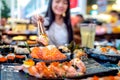 Asian lady eat a Salmon fish sashimi and Sushi in Japanese restaurant Royalty Free Stock Photo
