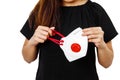 Asian lady holding face mask focus in front view with white plain background. Young lady showing face mask for use to helps protec