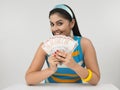 Asian lady with indian currency Royalty Free Stock Photo