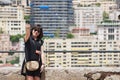 Asian lady makes selfie with a smartphone at the viewpoint in Monaco.