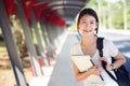 Asian lady student in university walking in walk way Royalty Free Stock Photo