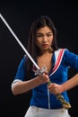 Asian lady with sword in studio Royalty Free Stock Photo