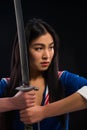 Asian lady with sword in studio Royalty Free Stock Photo