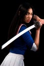 Asian lady with sword in studio Royalty Free Stock Photo