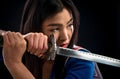 Asian lady with sword in studio Royalty Free Stock Photo