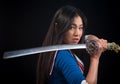 Asian lady with sword in studio Royalty Free Stock Photo