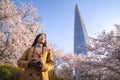 Asian lady travel and warking in cherry blossom park