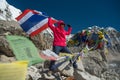 Asian lady trekker with Thai flag summit everest base camp ,nepal.travel concept