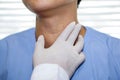 Asian lady woman patient have abnormal enlargement of thyroid gland Hyperthyroidism overactive thyroid at the throat, healthy Royalty Free Stock Photo