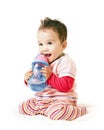 Asian laughing baby boy with spout cup