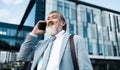 Asian leader, senior man, phone call and communication for business, connect or conversation outdoor. Leadership Royalty Free Stock Photo