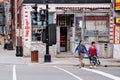 Asian lgbt female couple trying to cross the street hand in hand in Chinatown