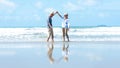 Asian Lifestyle senior couple walking and dancing chill on the beach happy in love romantic Royalty Free Stock Photo