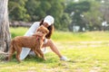 Asian lifestyle woman playing  with golden retriever friendship dog so happy and relax near the road Royalty Free Stock Photo